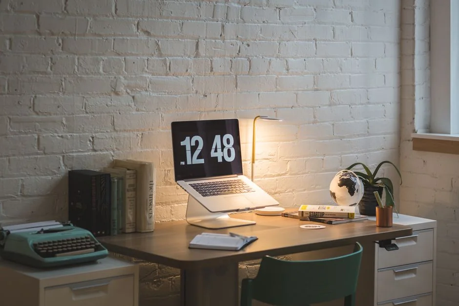 A modern computer screen displaying web design work, showcasing creative visuals in a workspace.